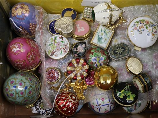 A collection of enamelled patch and trinket boxes, including two Faberge style egg paste-set examples and a crown